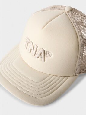 TNA Embroidered Logo Trucker Hat in Cream
